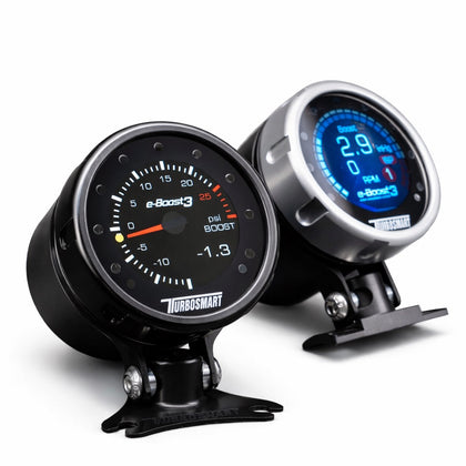 Two automotive gauges with digital and analog displays on a white background