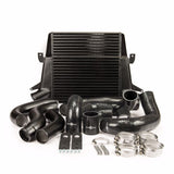 An intercooler kit with a black stepped core, including aluminium piping, silicone joiners, and stainless steel hose clamps, primarily in black.