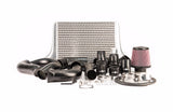 A set of black performance vehicle parts including an intercooler core, throttle body relocation kit, and cold air intake system, with a Stage 2 intercooler designation.